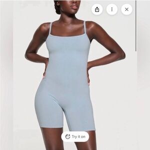 skims mid-thigh bodysuit